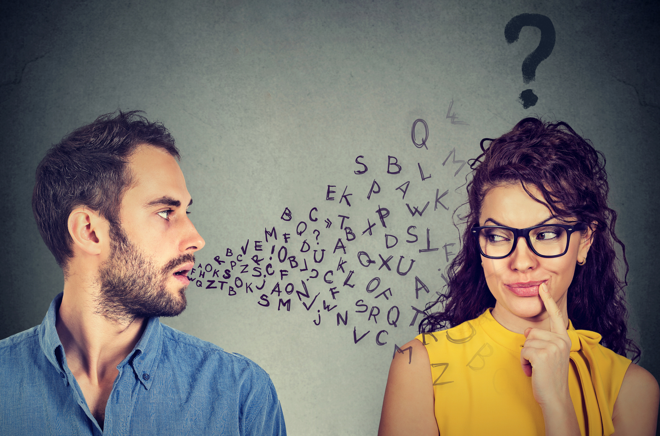 Language barrier concept. Man talking to a young woman with question mark