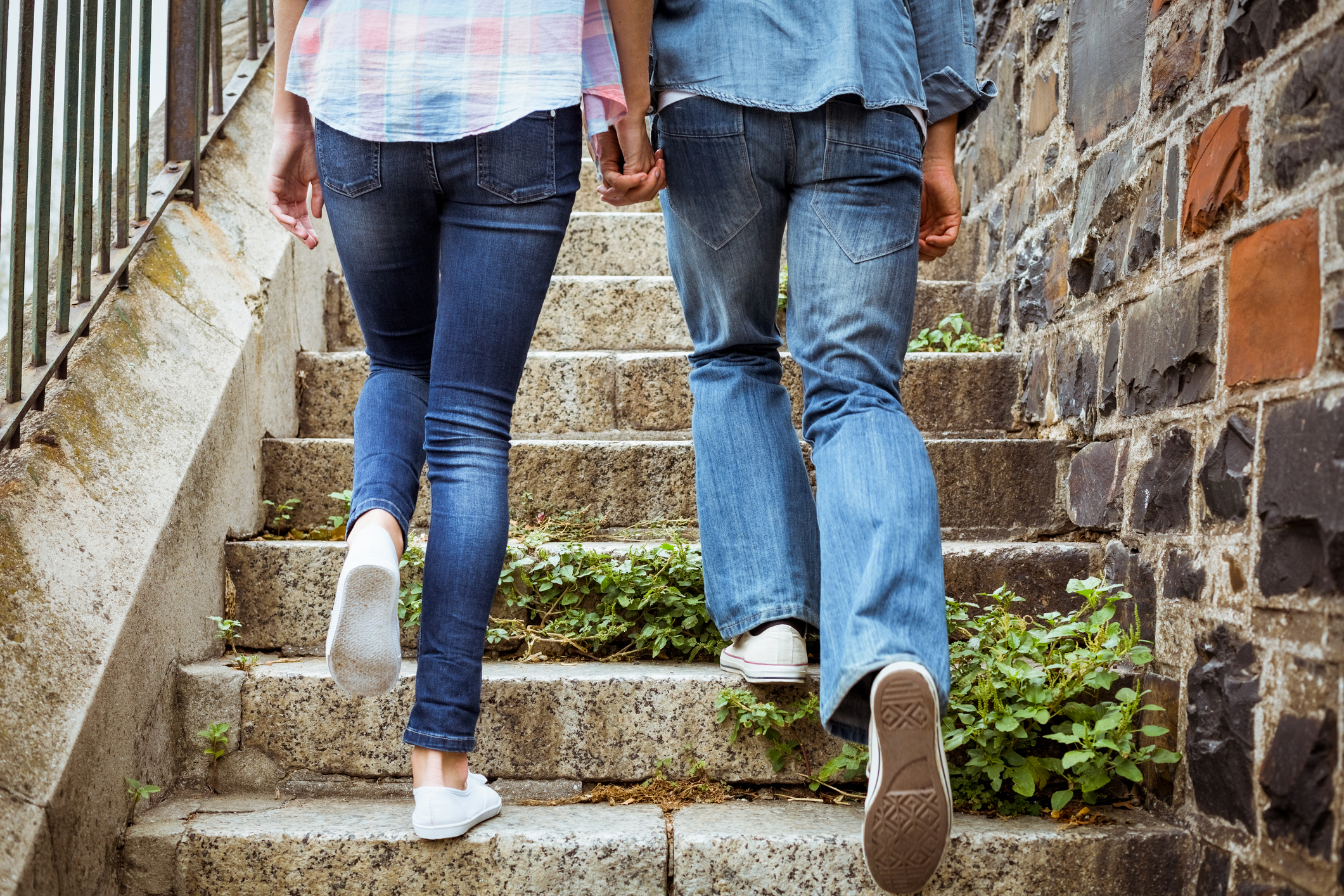 Hip young couple walking up steps