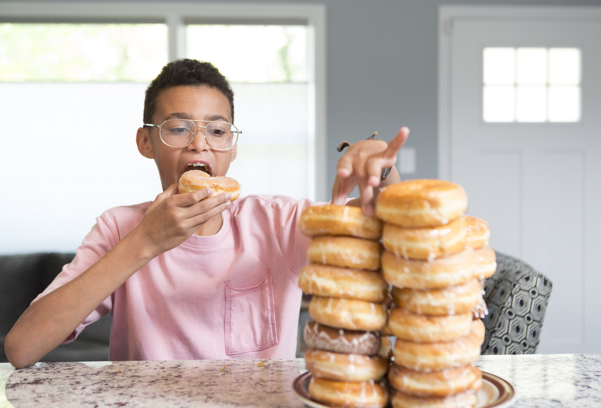 Boy Eating Donuts