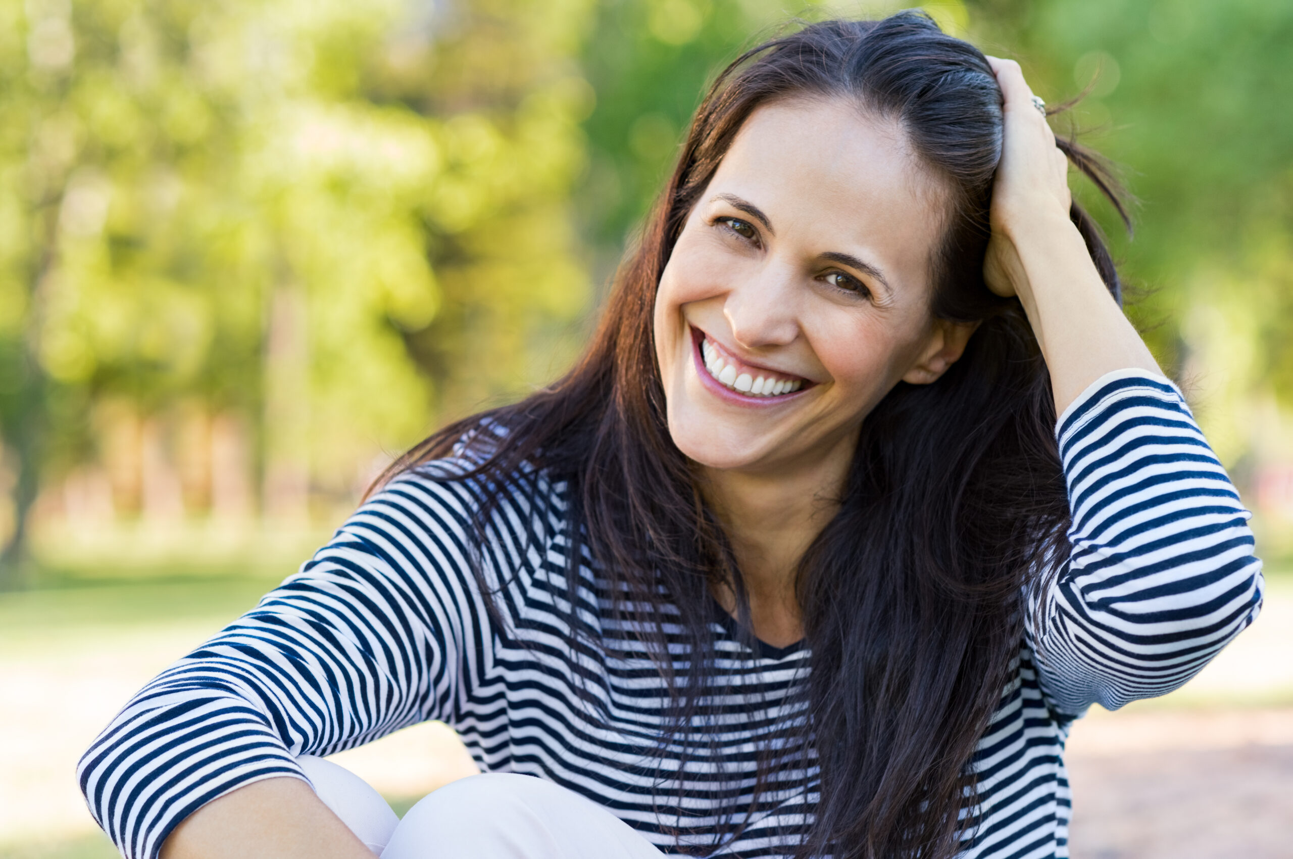 Laughing mid woman at park