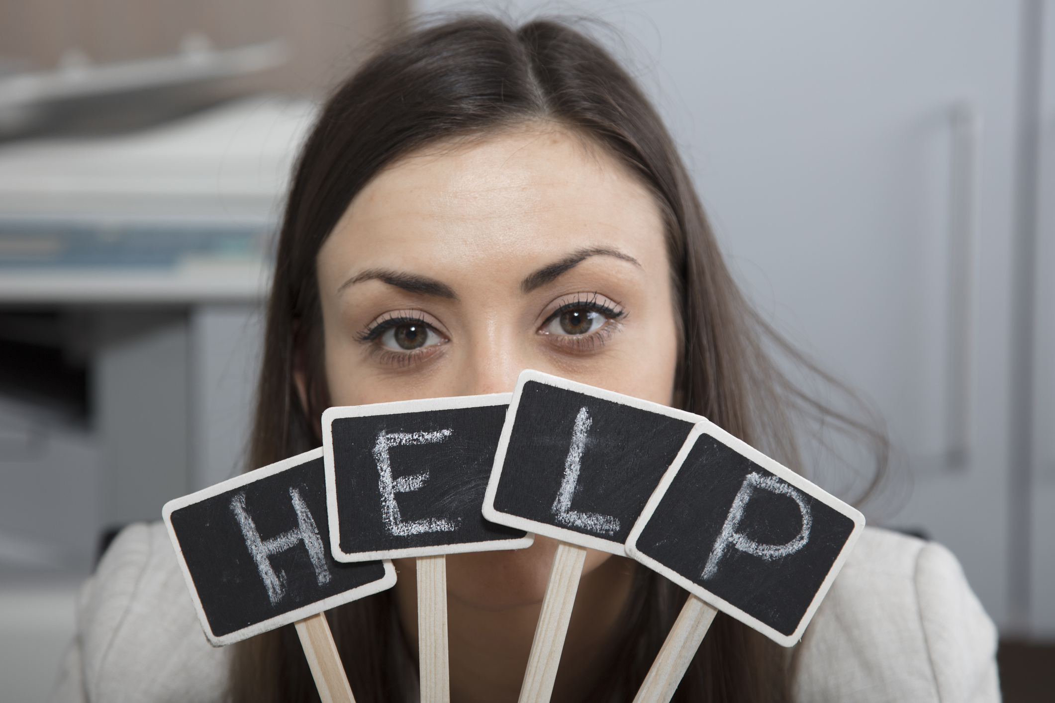 Business woman exposes her eyes for a sign