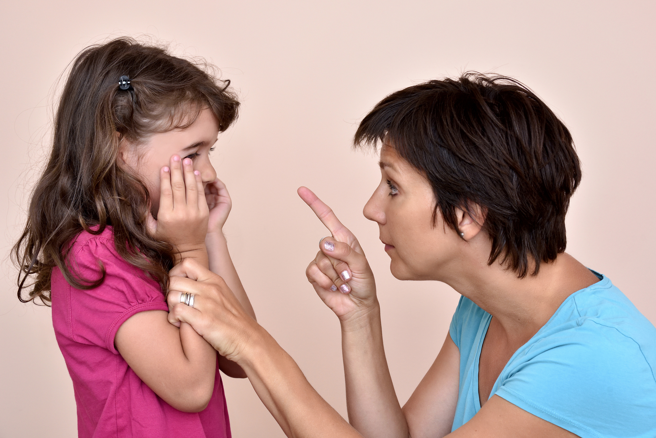 Mother scolding a daughter