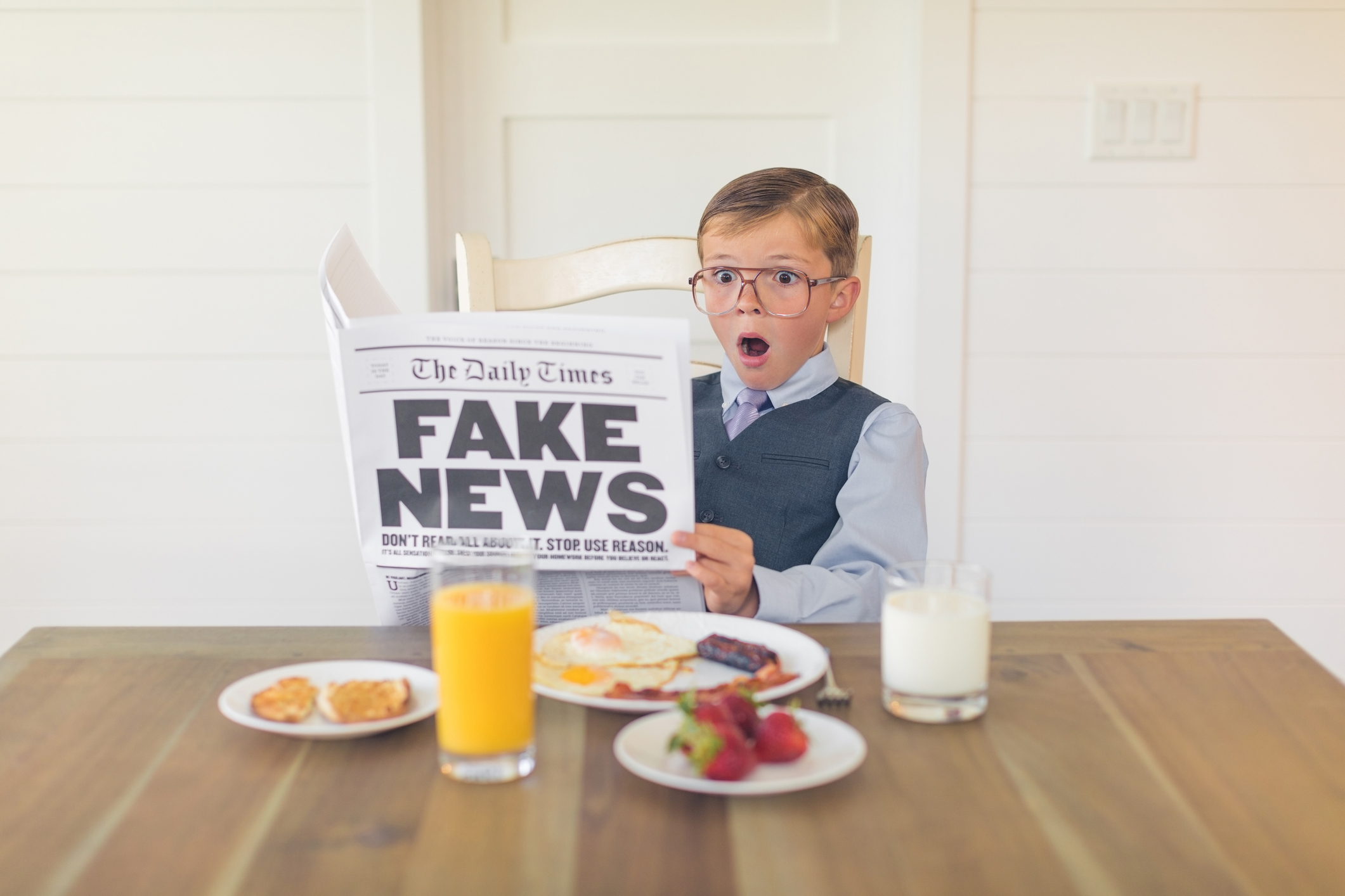 A Young Businessman Reading Fake News is Shocked