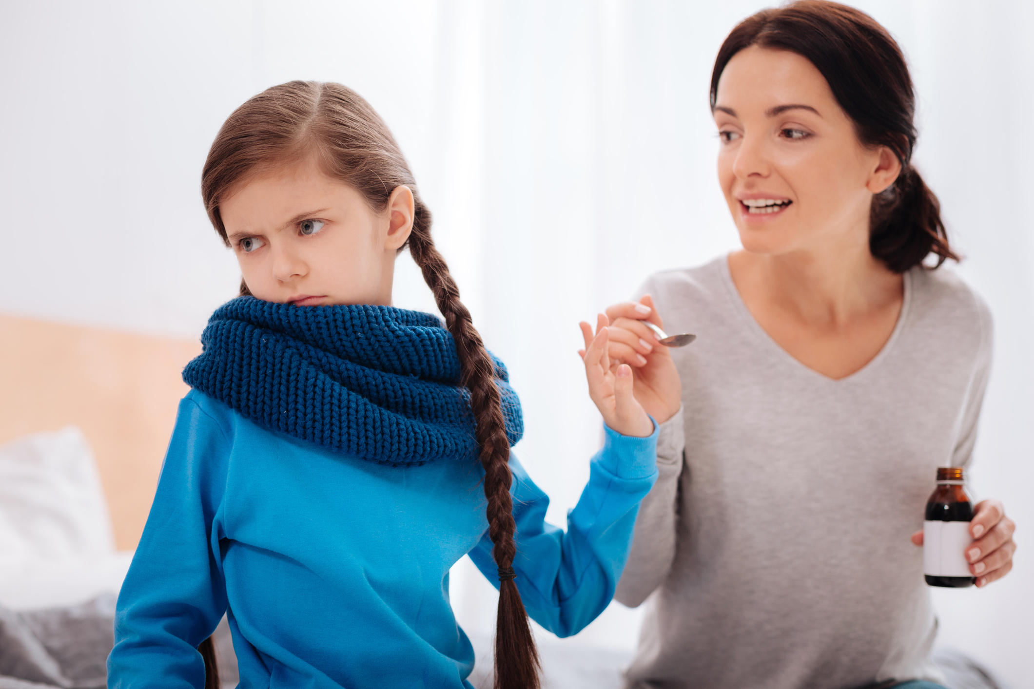 Angry little girl rejecting important treatment