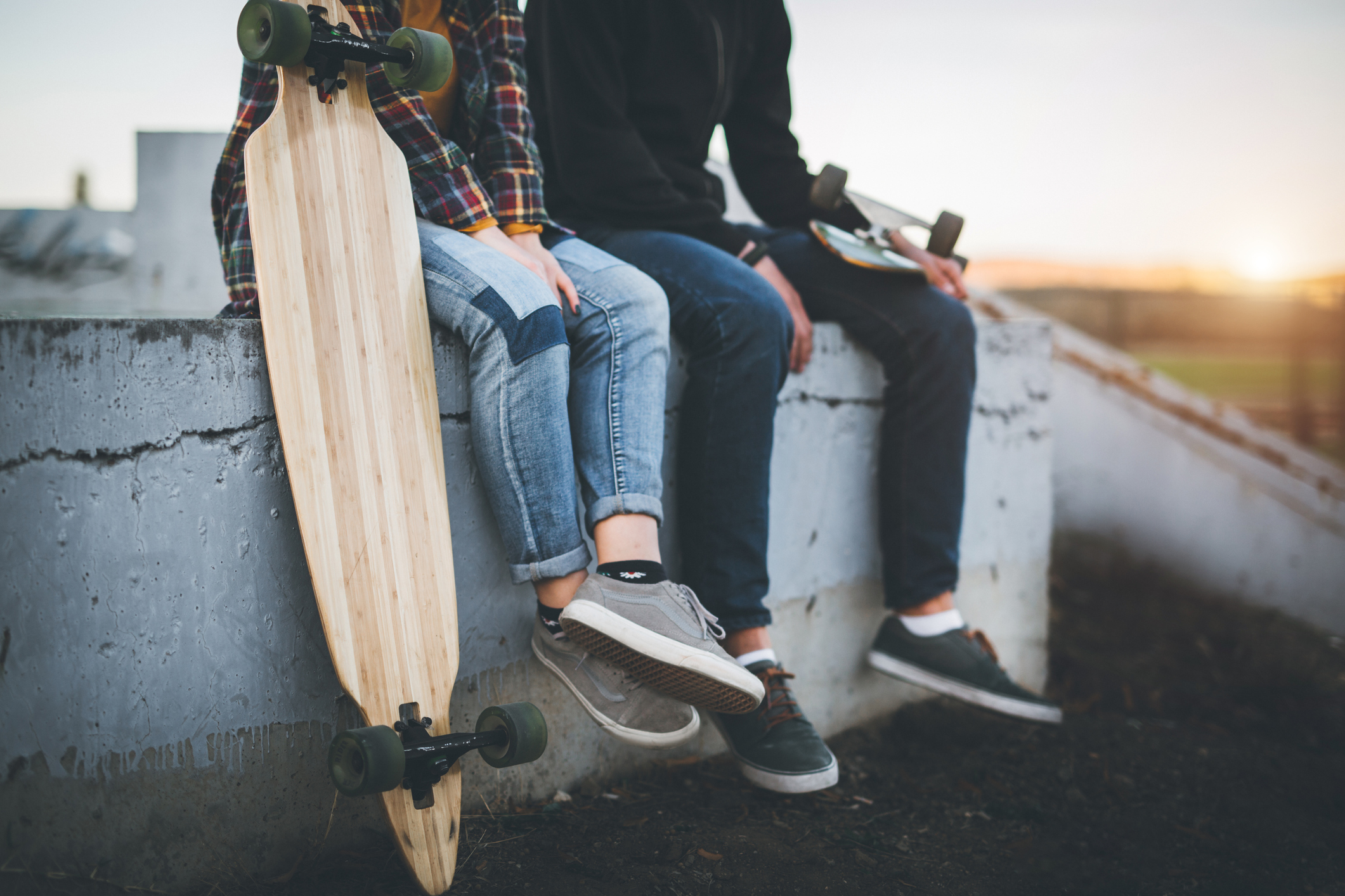 Skateboarders taking a rest in skate park