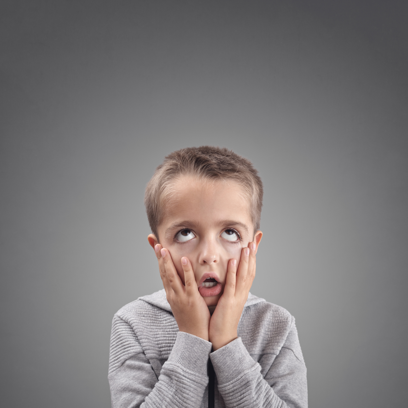 Shocked and surprised child fed up, bored or showing despair