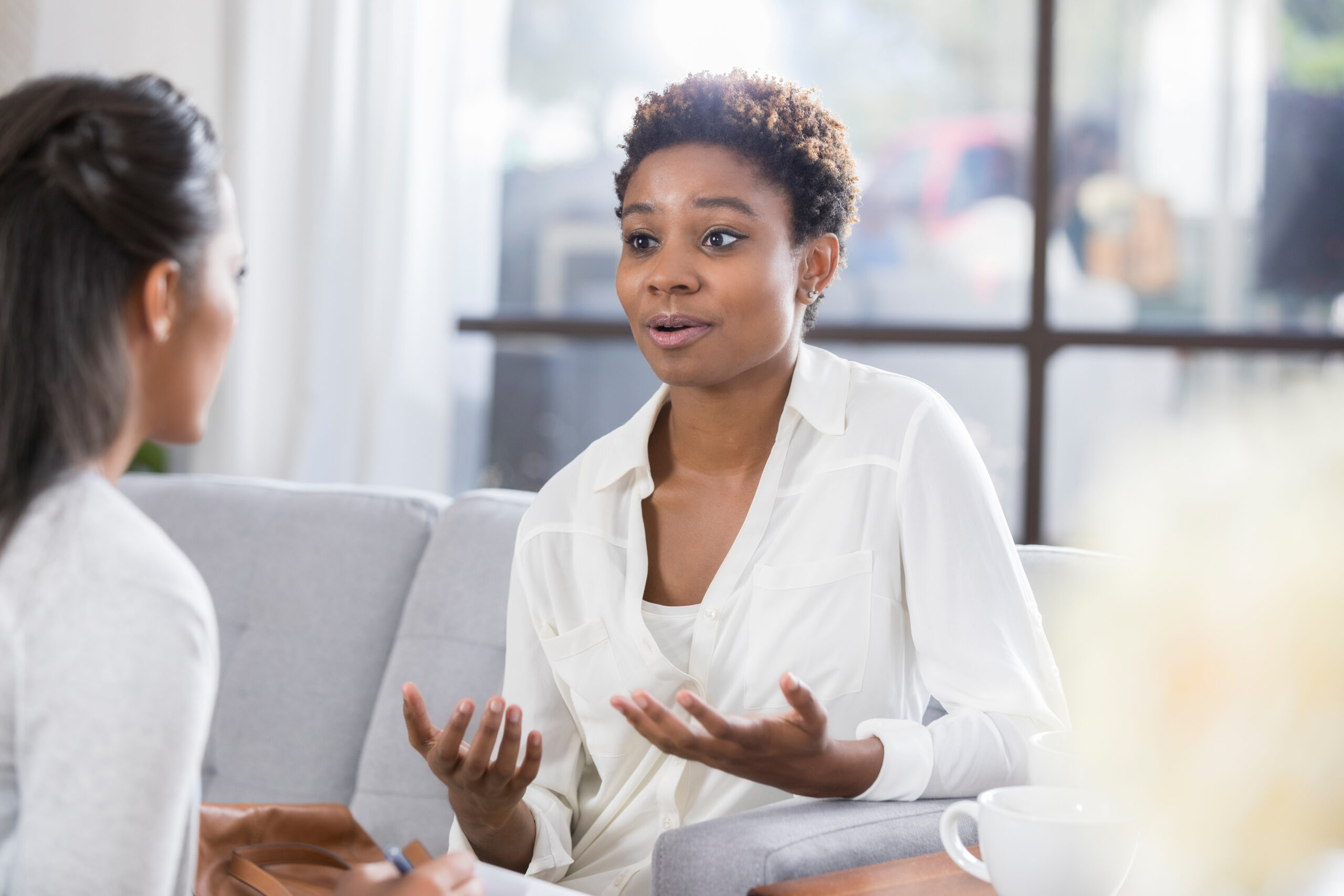 Concerned woman talks with therapist