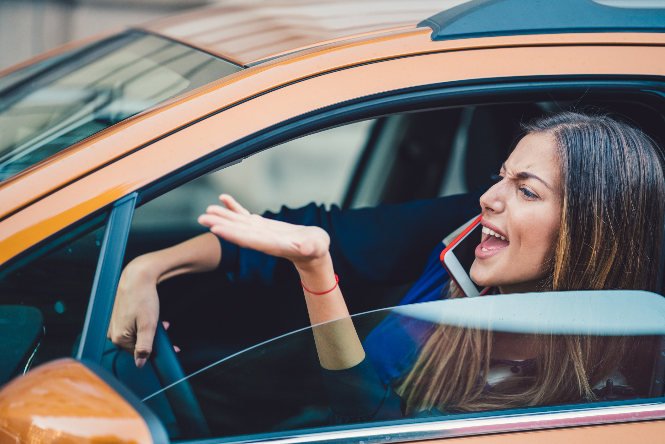 Furious woman stucked in traffic jam