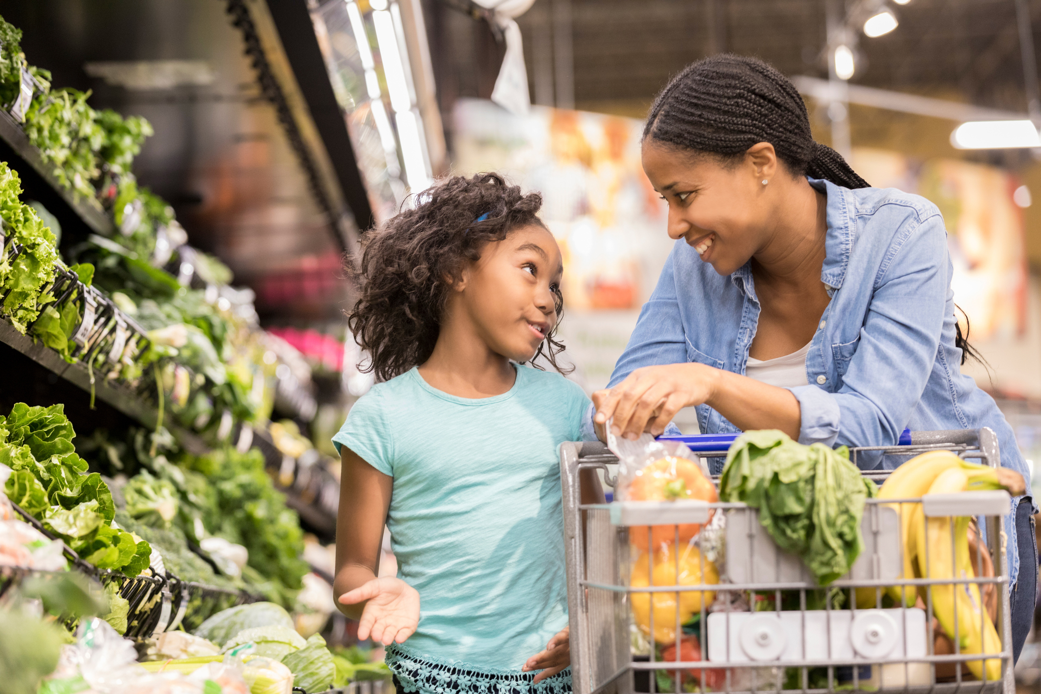 Young girl shops with her mom