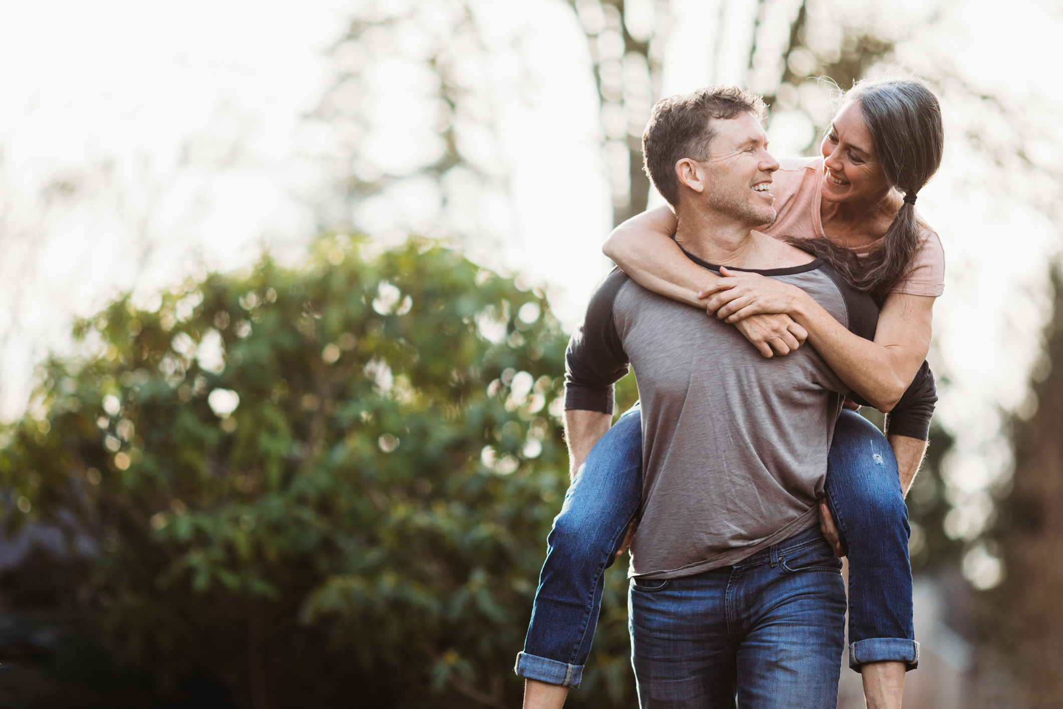 Loving Mature Couple Playing Outdoors