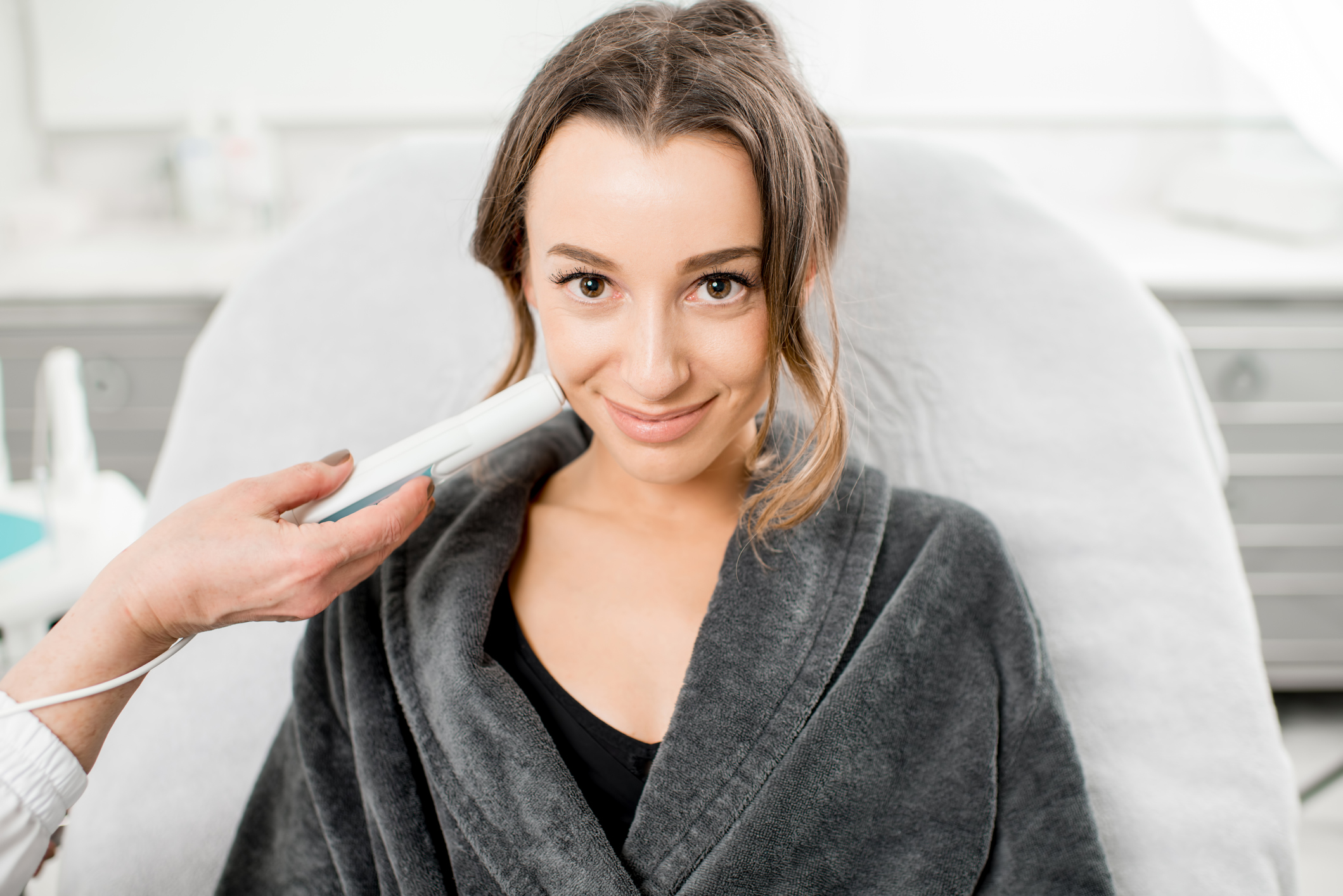 Woman during the procedure in cosmetological center