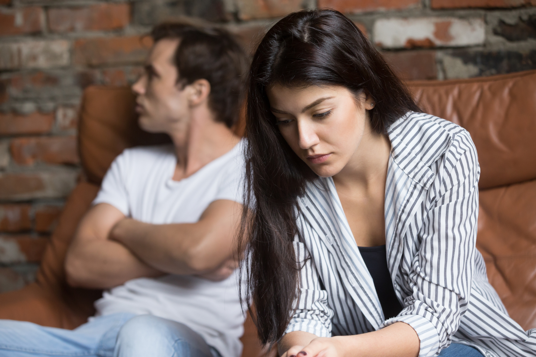 Sad pensive young girl thinking of relationships problems after fight