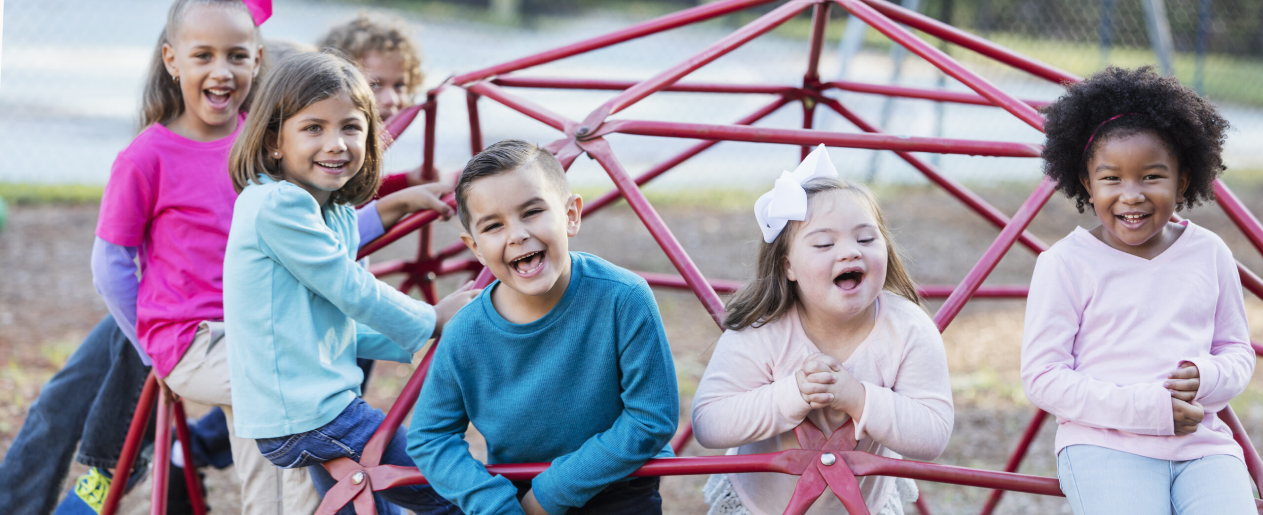 Children playing on playground monkey bars