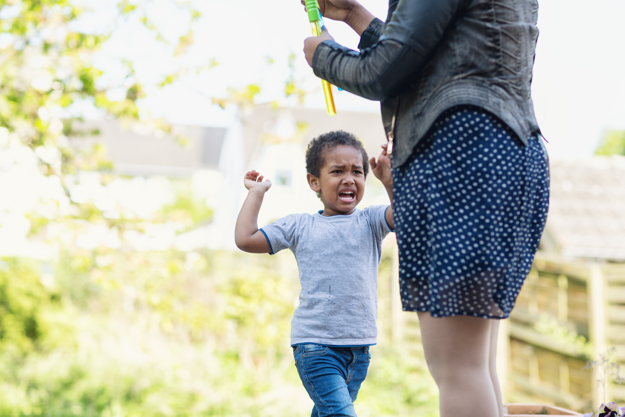 Toddler boy tantrum crying angry with mother