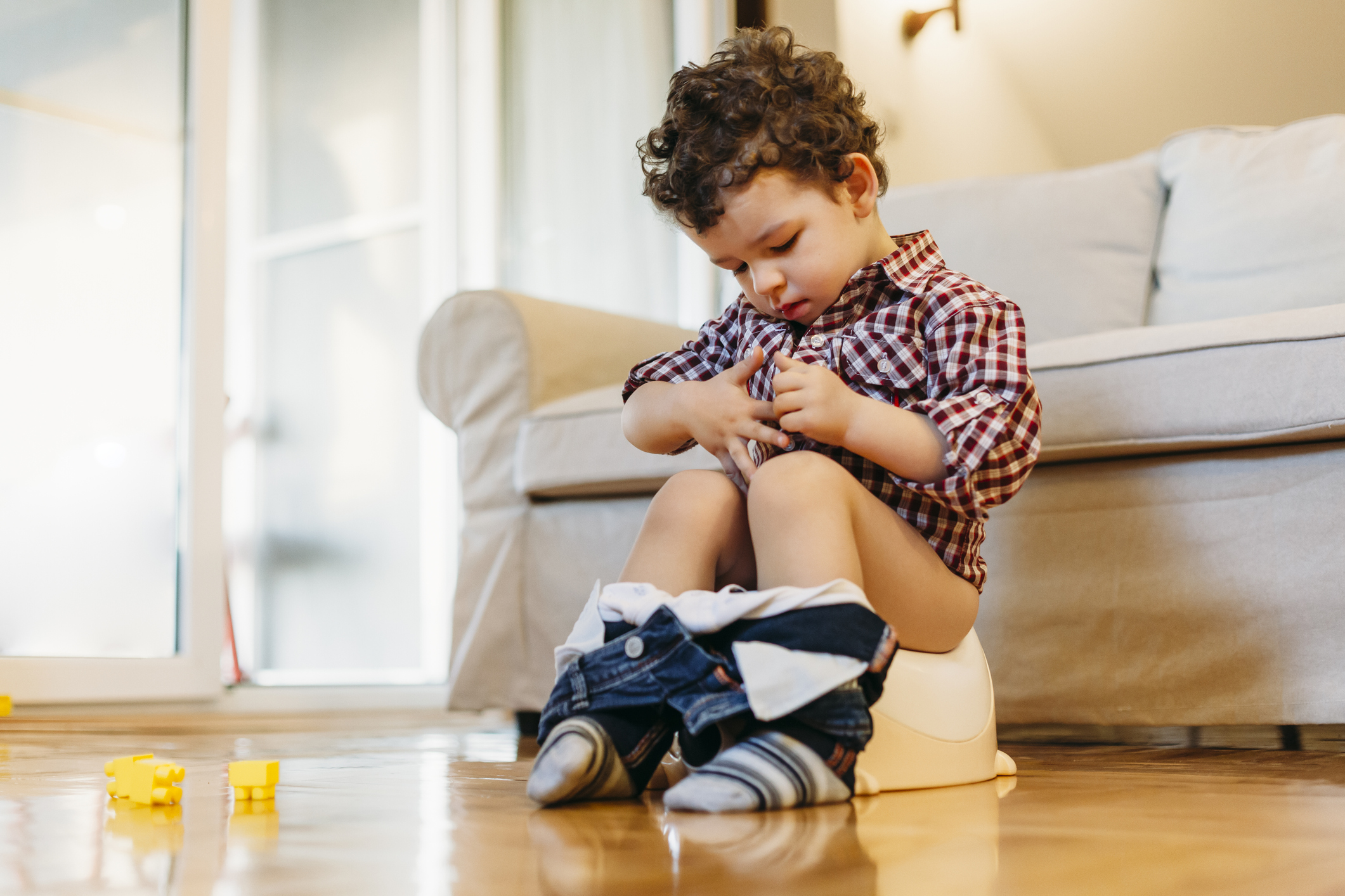 Little boy sitting on potty