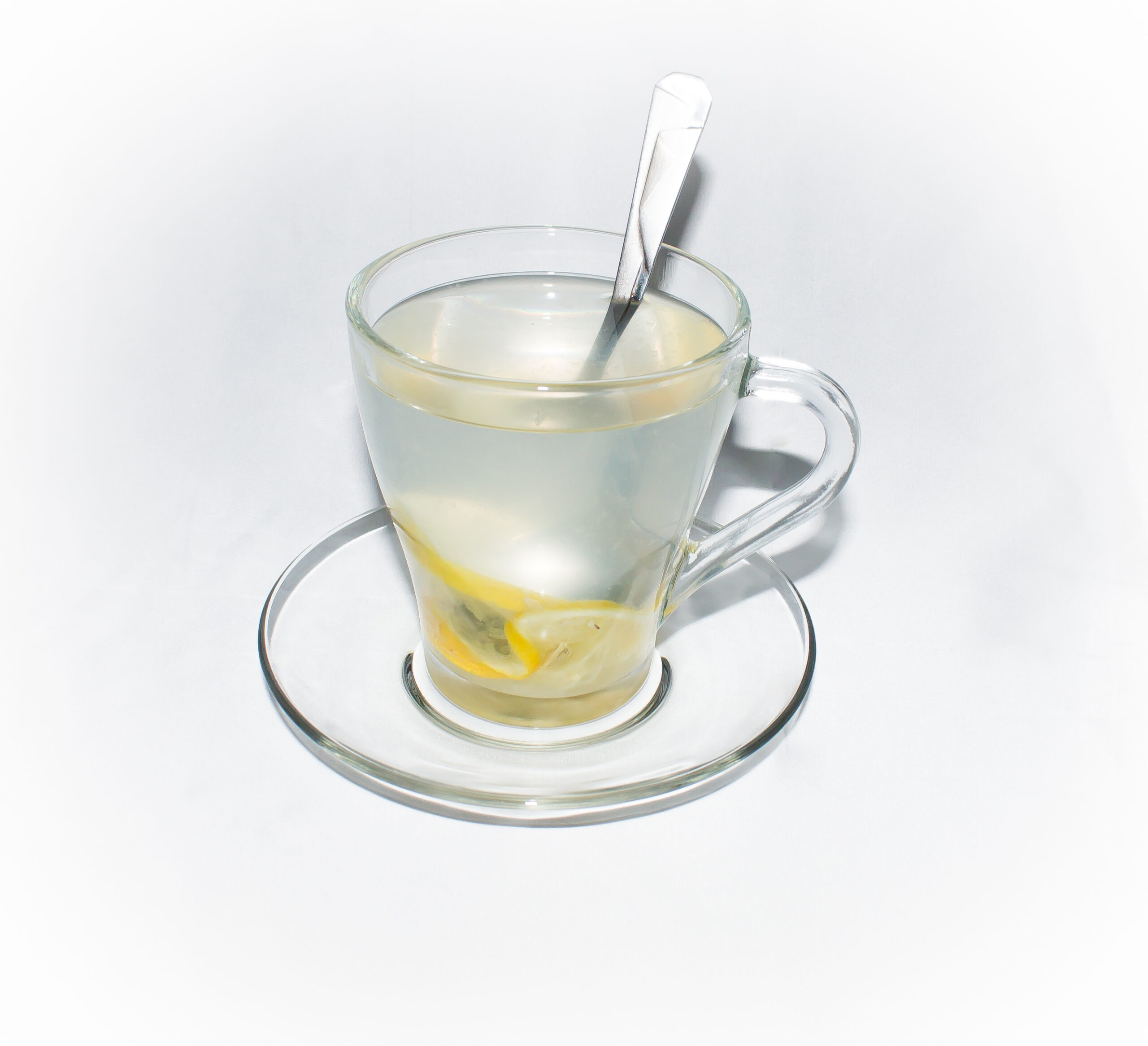 lemon juice in a glass mug and spoon