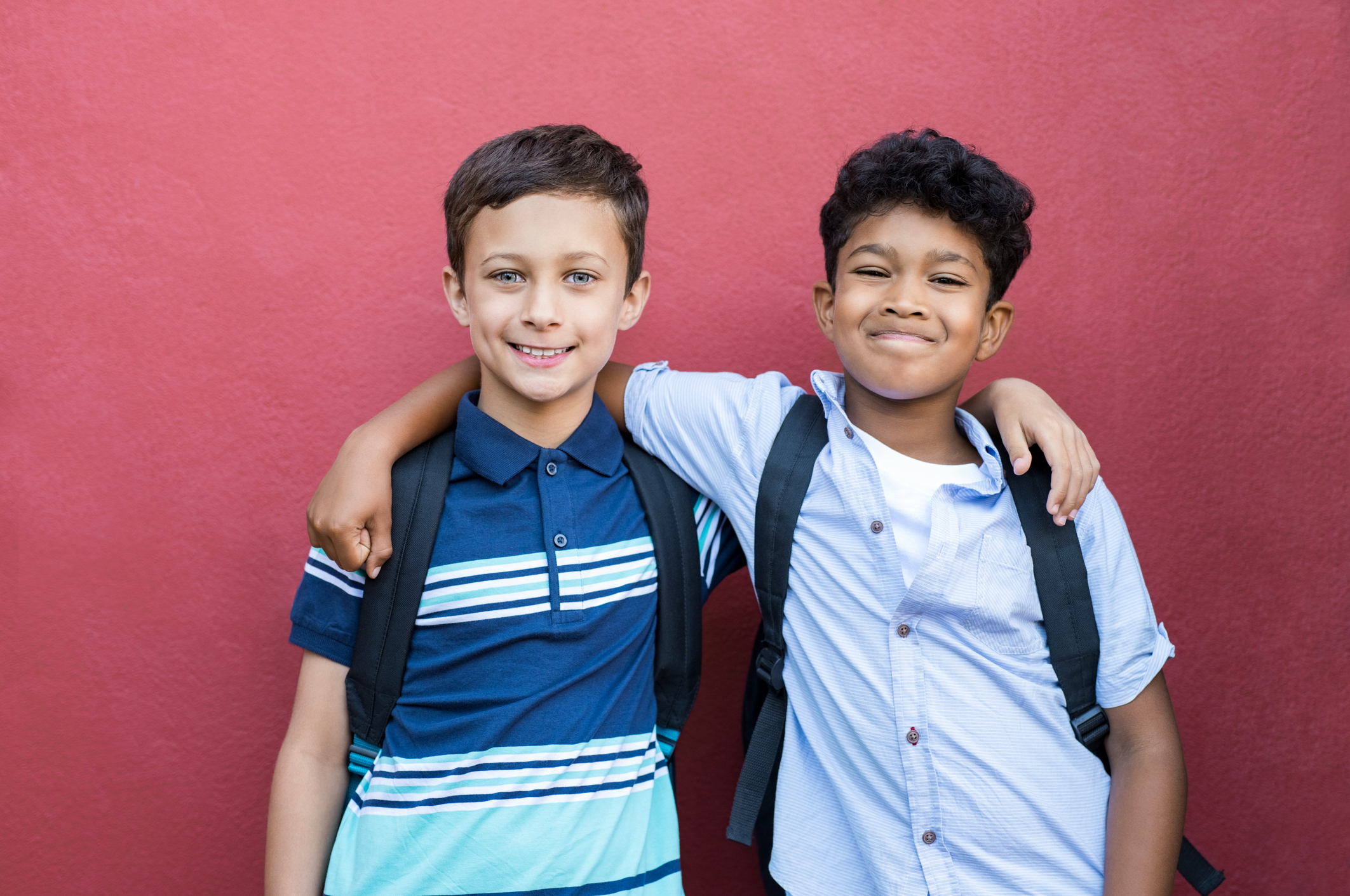 Smiling children friends embracing