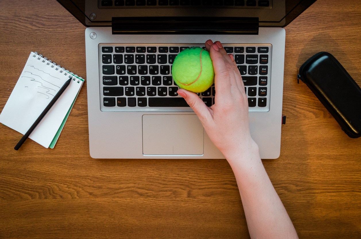 Rest in the break at the workplace. Girl playing tennis ball