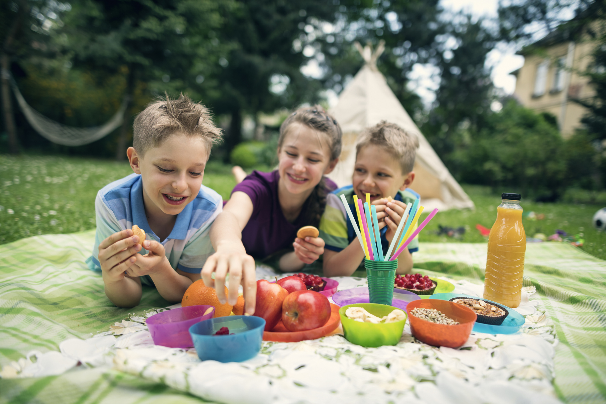 Children having fun at picnic in garden