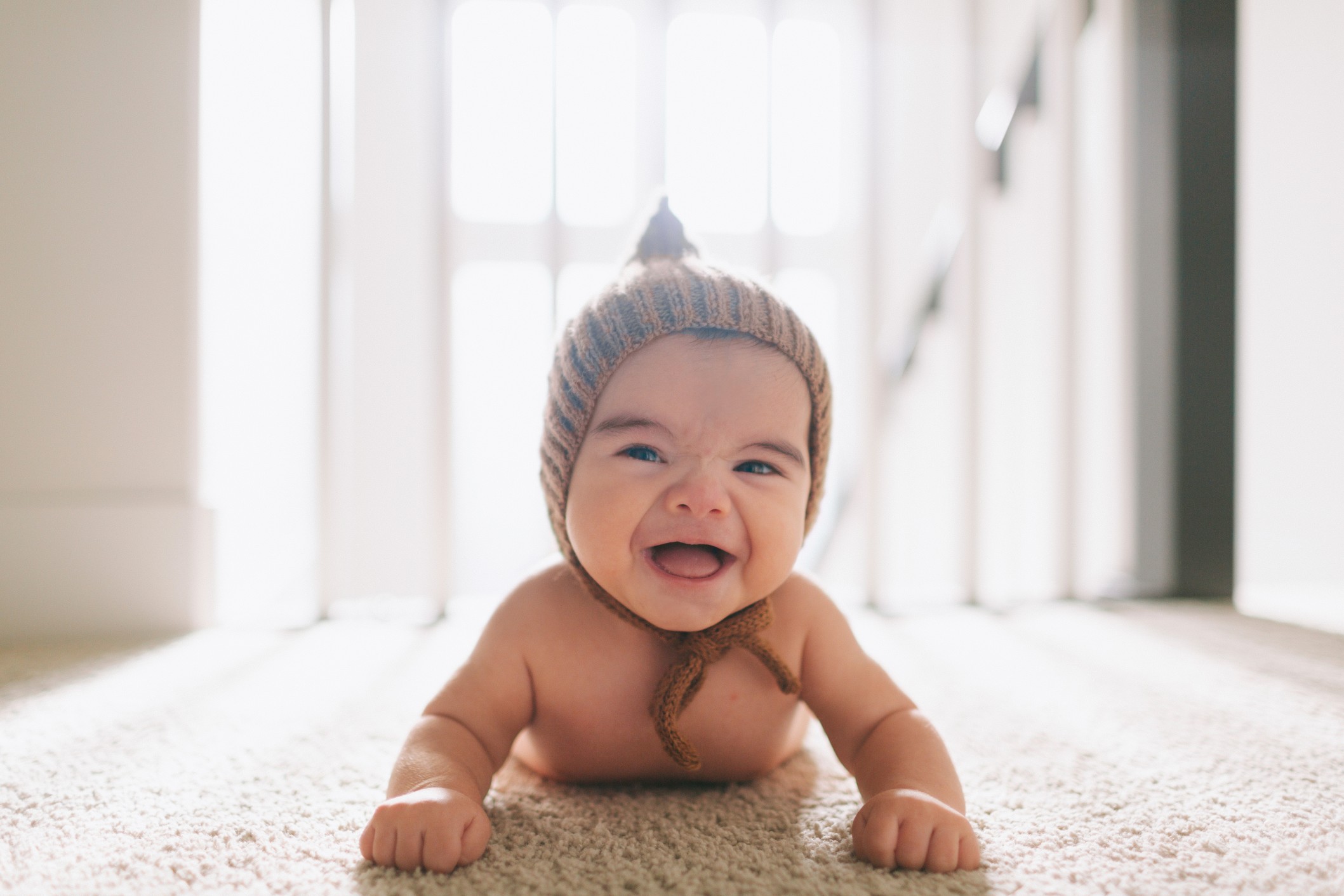 indoors-hat-cute-smiling-baby-home-happy-laughing-tummy-time_t20_pR7NO8.jpg