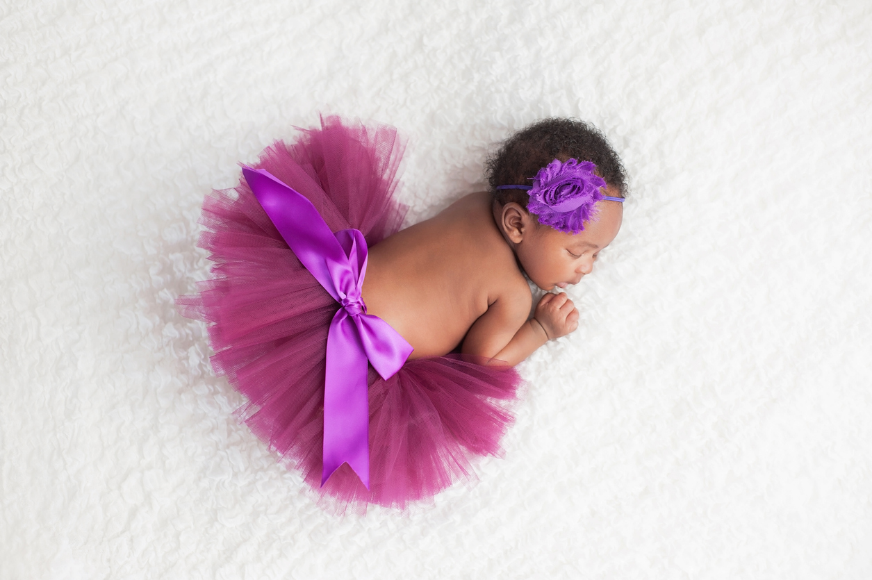 Newborn Baby Girl Wearing a Purple Tutu