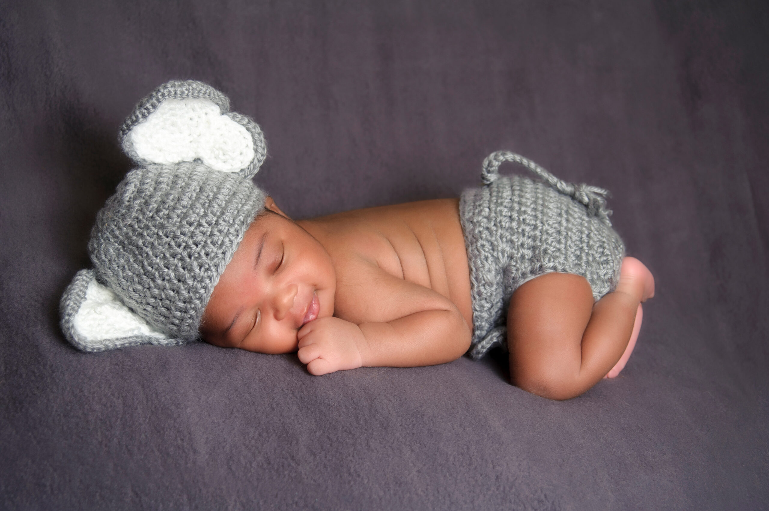 Smiling Newborn Wearing an Elephant Costume