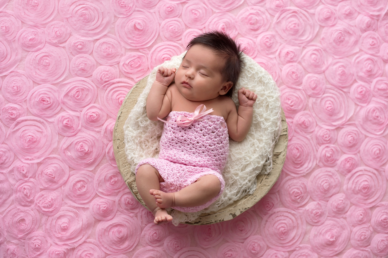 Baby Girl Wearing a Pink, Crocheted Romper