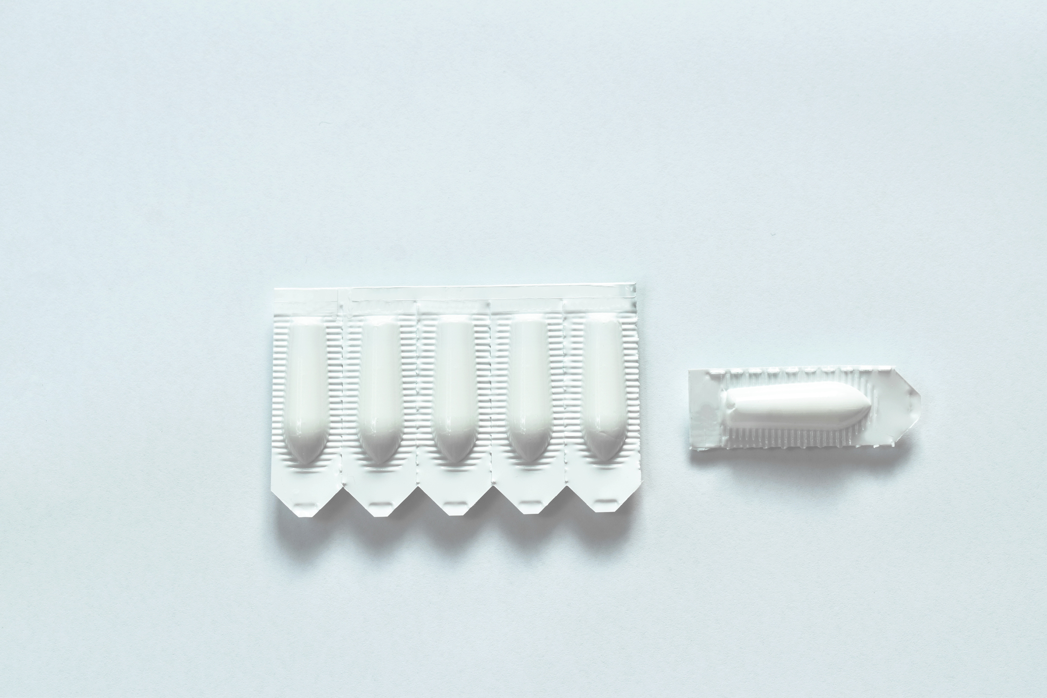 corticosteroid cream for hemorrhoid therapy used by insert in bottom hole packing on white background