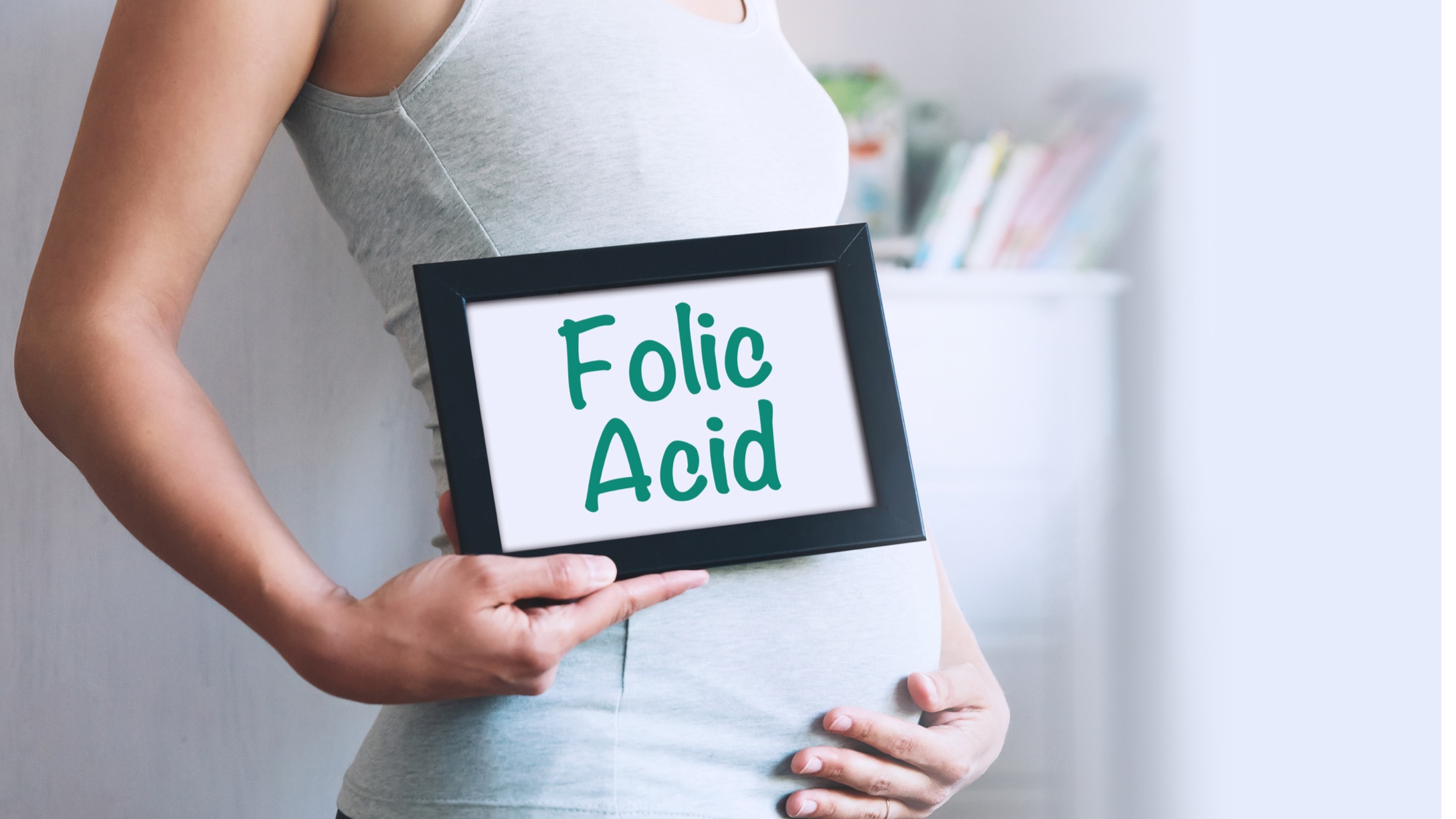 pregnant-woman-holds-whiteboard-with-text-message-folic-acid-picture-id670425684-1.jpg