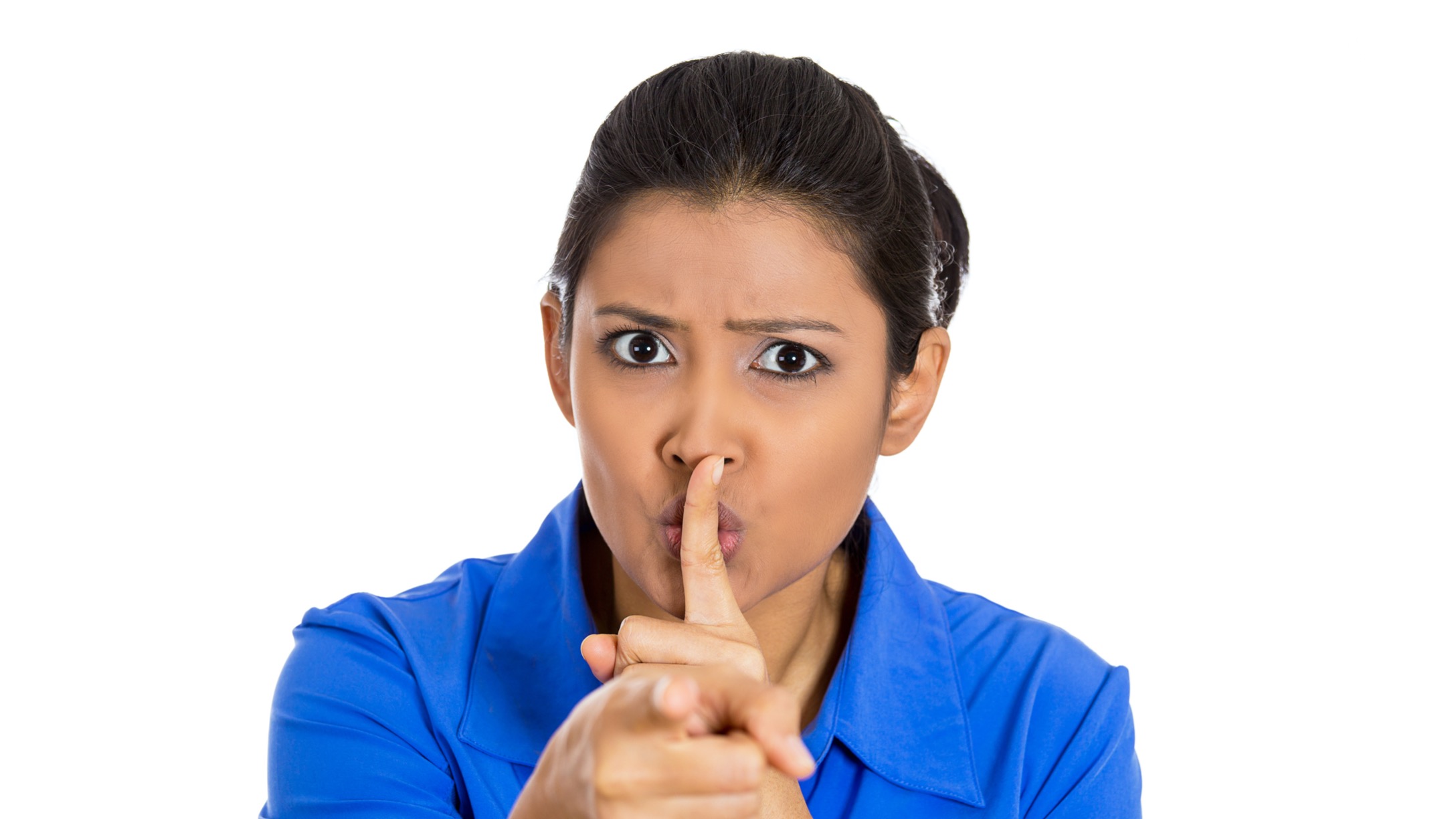 serious-woman-placing-finger-on-lips-pointing-at-you-quiet-silence-picture-id1262670509.jpg