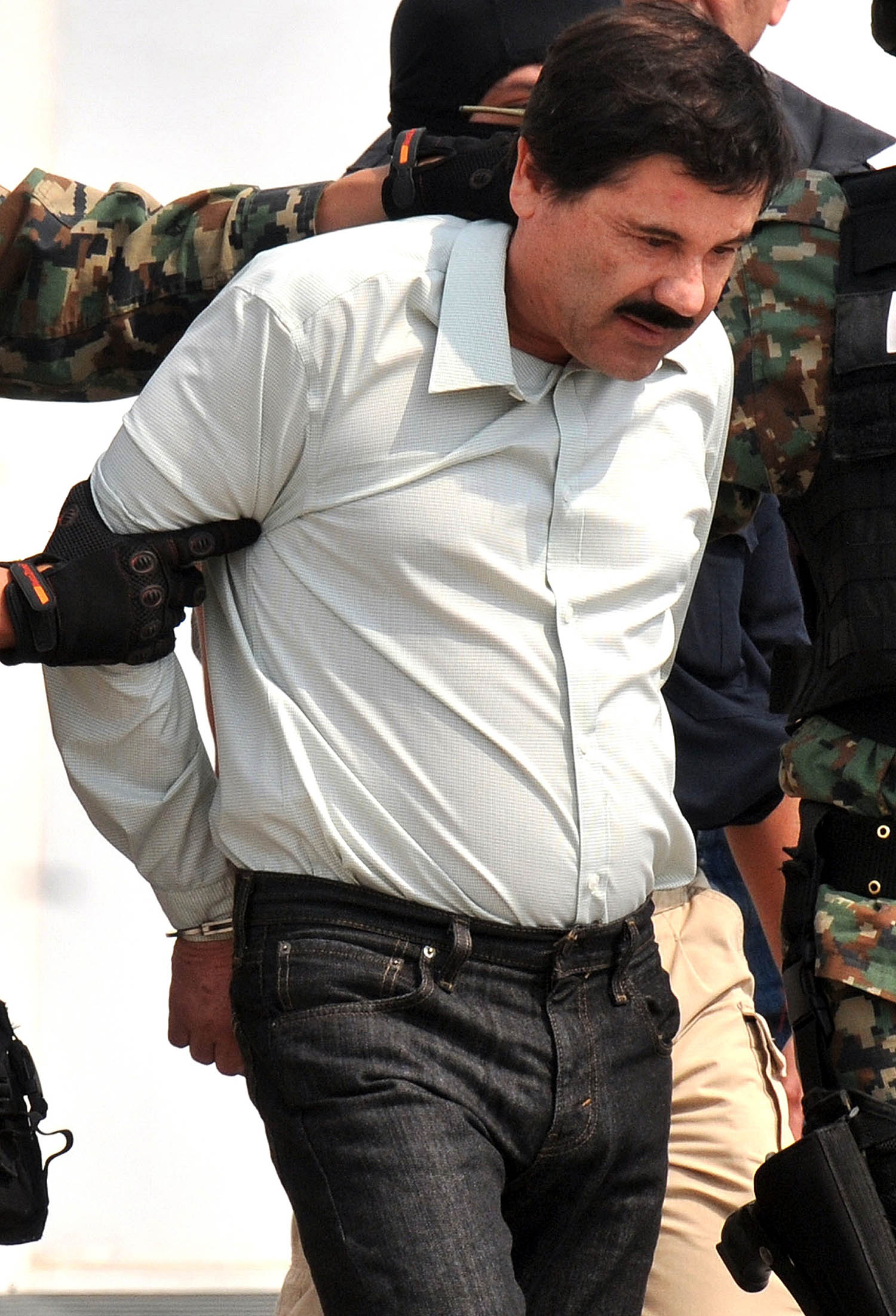 File pics of capture of Mexican druglord El Chapo in 2014, following previous jail escape