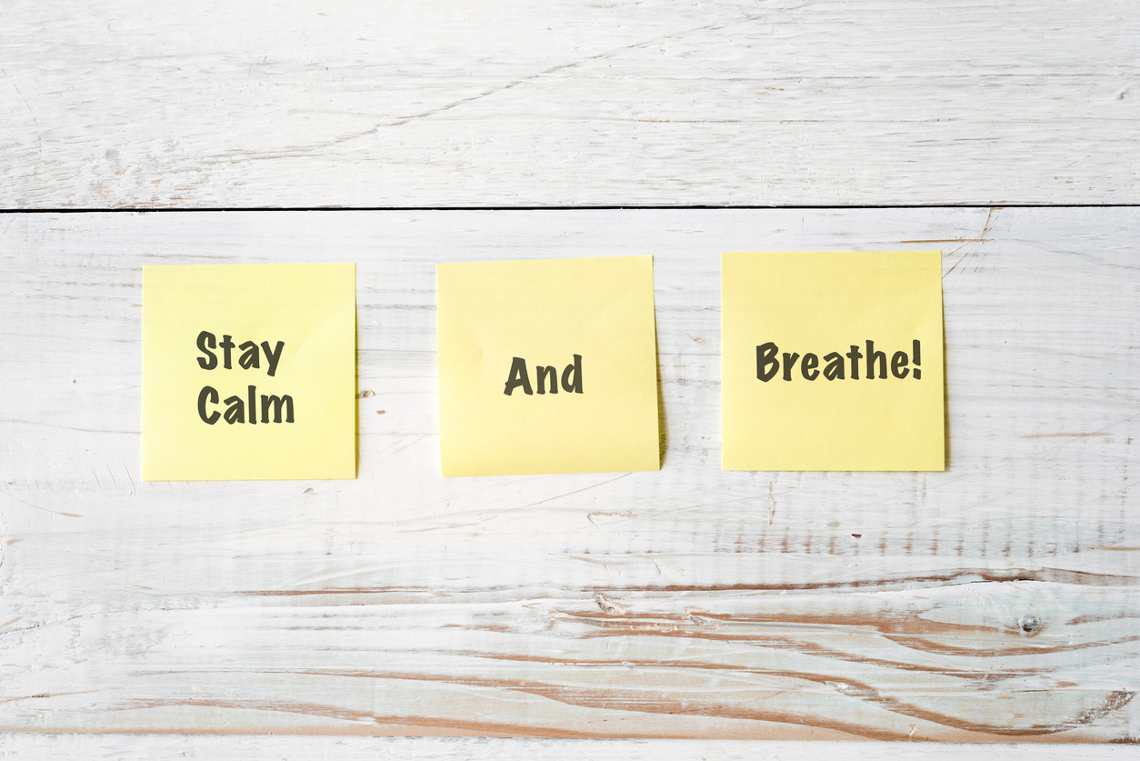 Three Yellow Post It notes with Message Stay Calm and Breathe!