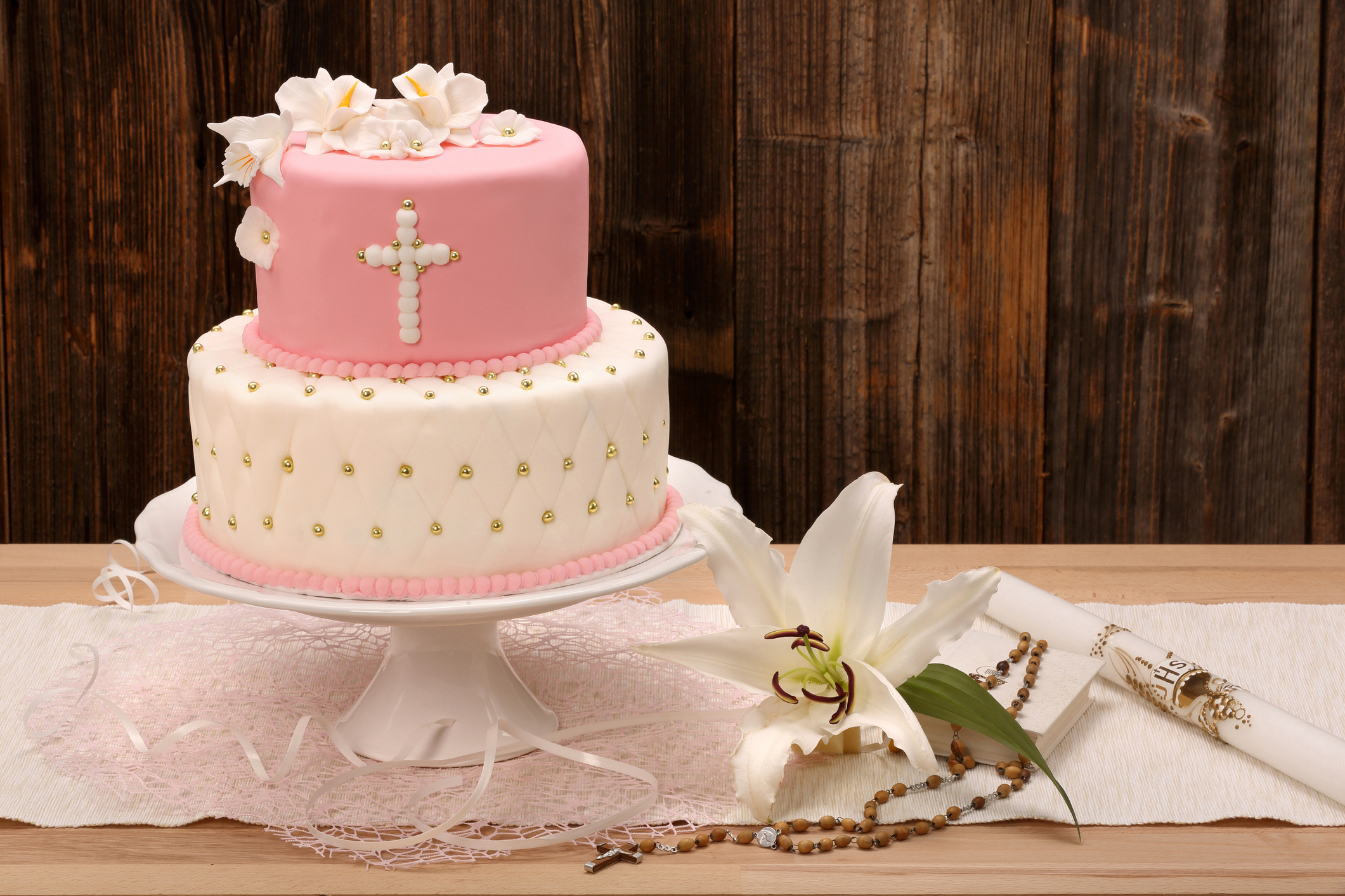 First holy communion cake on wooden background