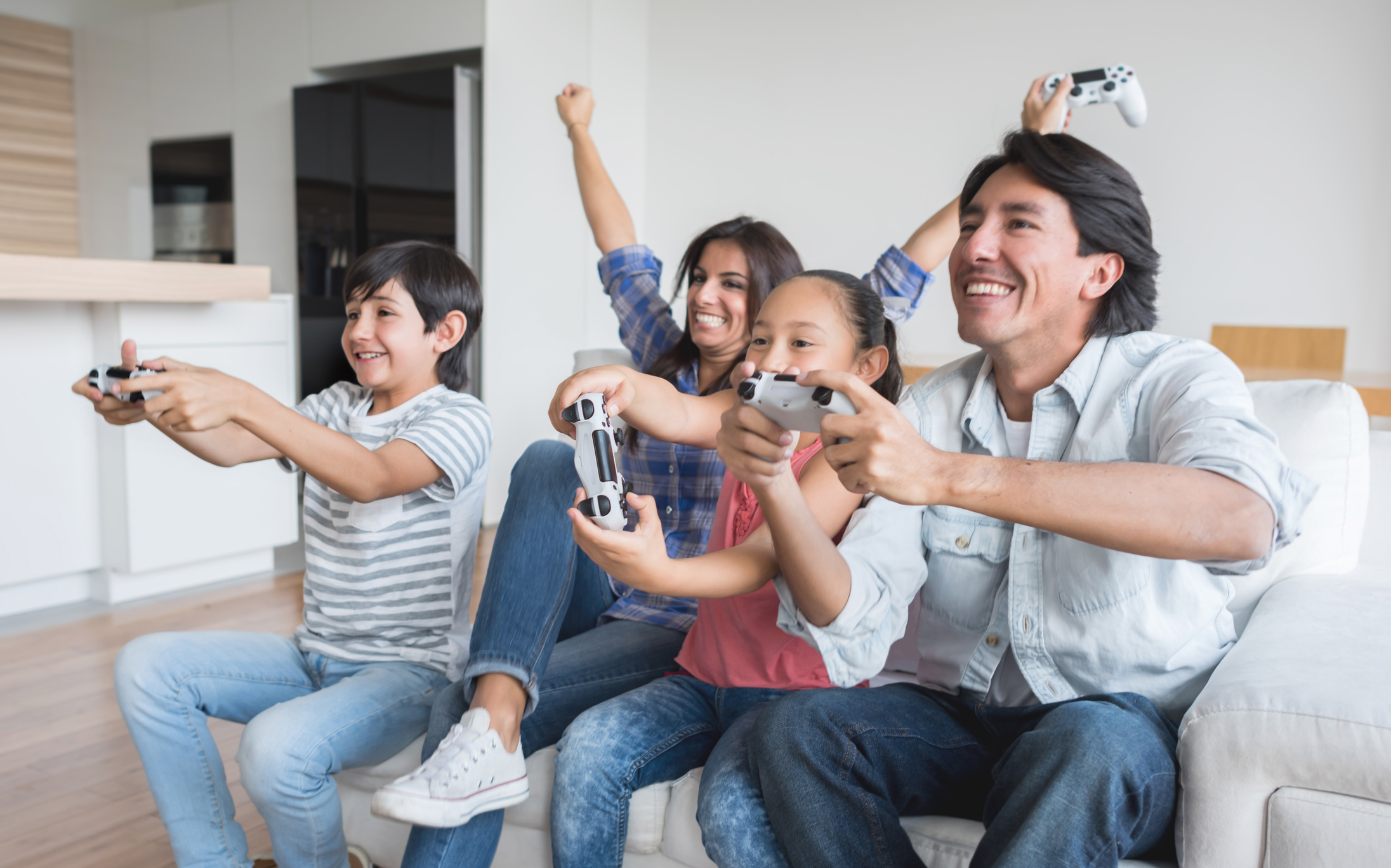 Family having fun playing video games