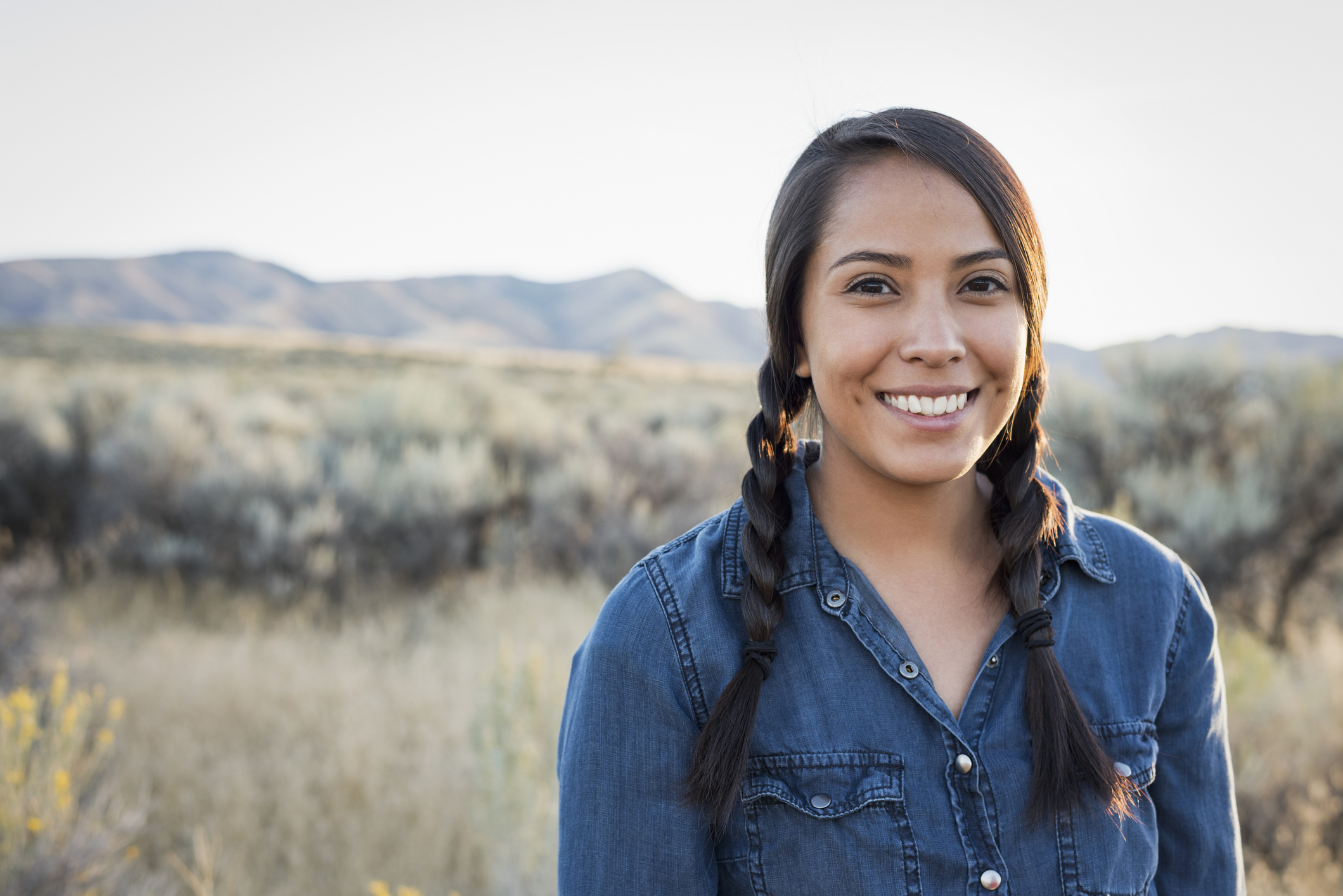 Young woman outdoors at sunset