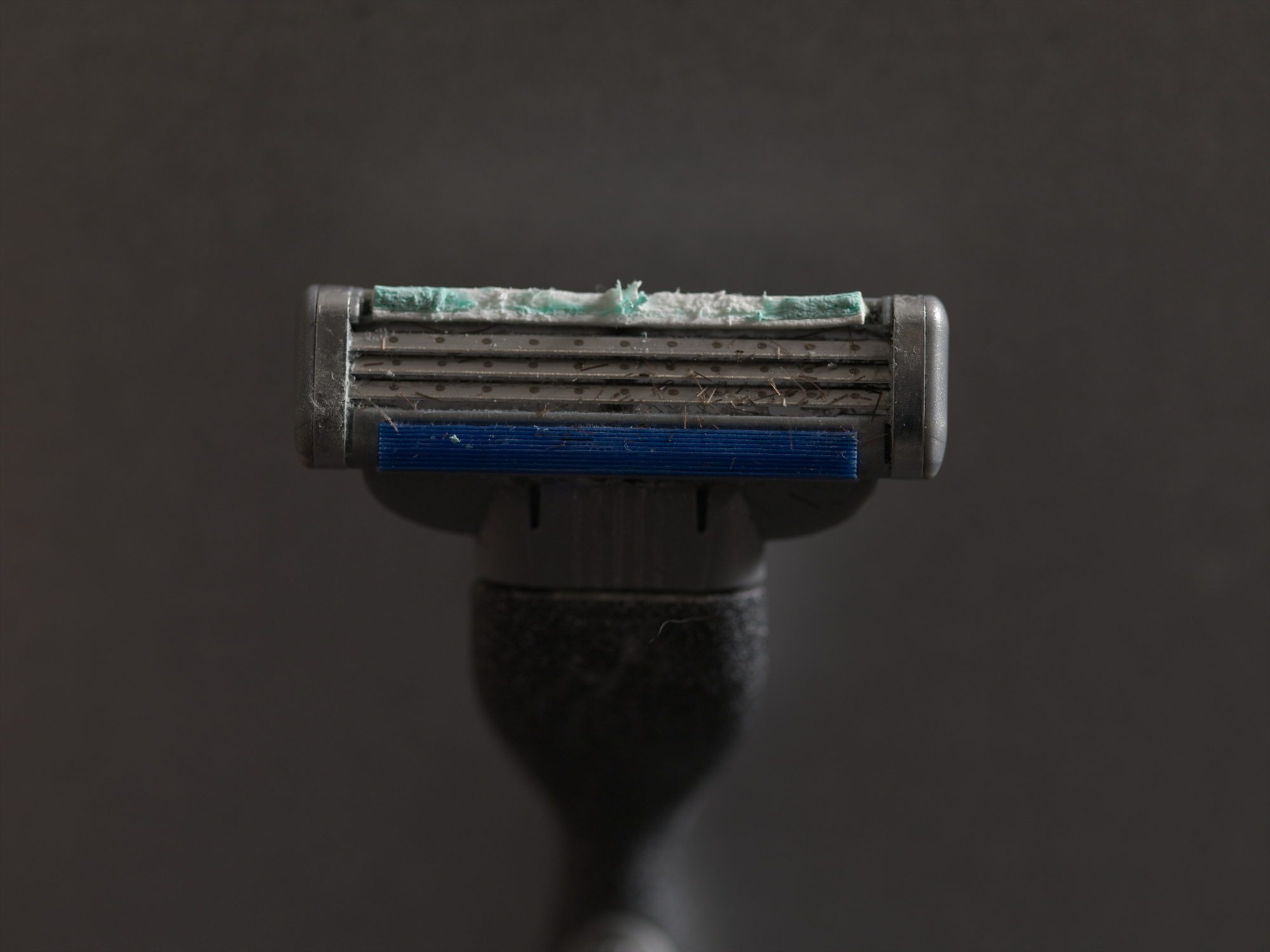 Used dirty razor, close up of head