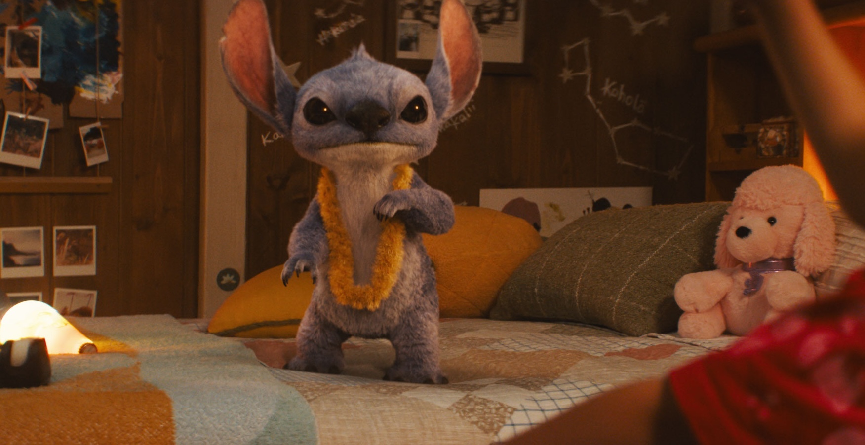 Stitch on a bed from the live-action remake of Lilo & Stitch